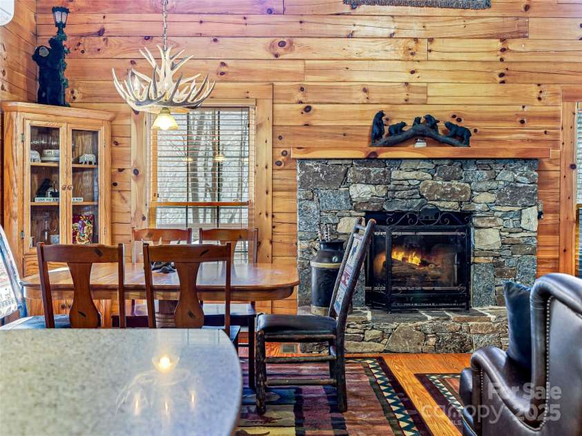 71 Honeymoon Lane, Maggie Valley, NC 28751.  MLS# CAR4240026, YatesRealty ID 11581. Gorgeous stone, wood burning fireplace