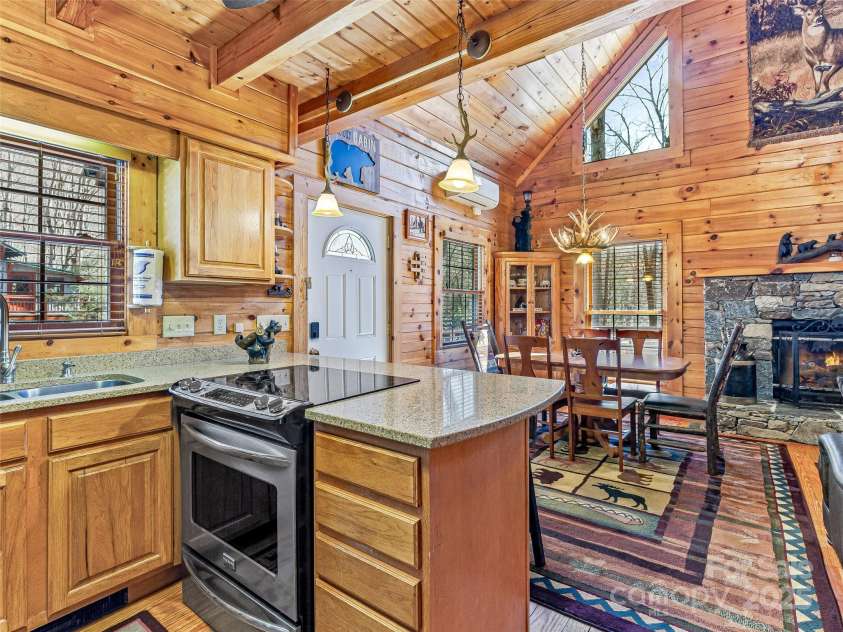 71 Honeymoon Lane, Maggie Valley, NC 28751.  MLS# CAR4240026, YatesRealty ID 11581. Kitchen island with seating for two.
