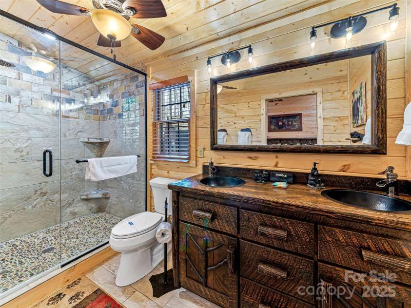71 Honeymoon Lane, Maggie Valley, NC 28751.  MLS# CAR4240026, YatesRealty ID 11581. Primary ensuite bathroom with double vanity