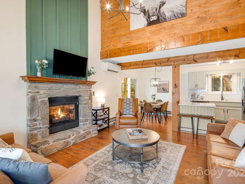 21 Susan Drive, Maggie Valley, NC 28751.  MLS# CAR4241989, YatesRealty ID 11582. 2 story great room with fireplace