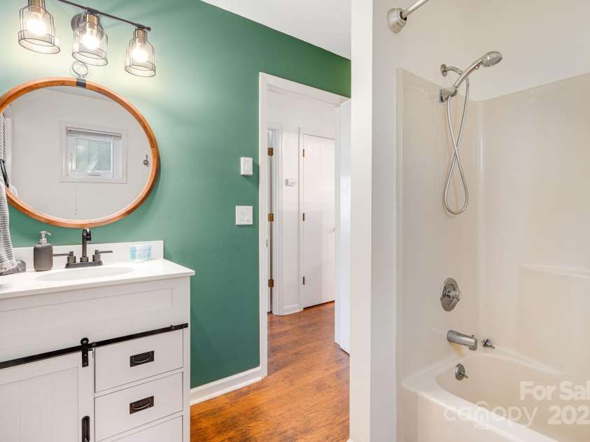 21 Susan Drive, Maggie Valley, NC 28751.  MLS# CAR4241989, YatesRealty ID 11582. Primary Bathroom downstairs