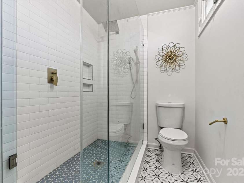 3995 Burton Lane, Denver, NC 28037.  MLS# CAR4219369, YatesRealty ID 11586. Large tiled showed in the primary bath