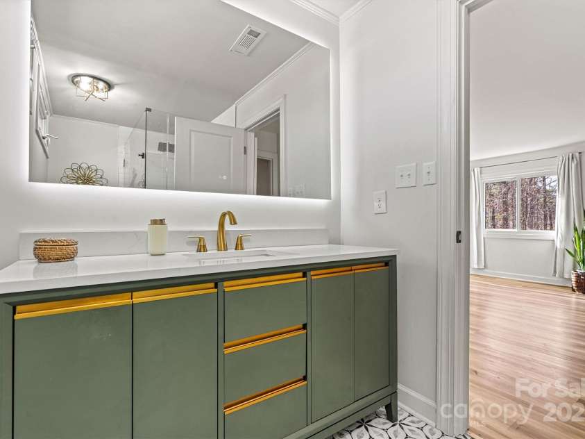 3995 Burton Lane, Denver, NC 28037.  MLS# CAR4219369, YatesRealty ID 11586. Primary ensuite bath, gorgeous flooring and vanity