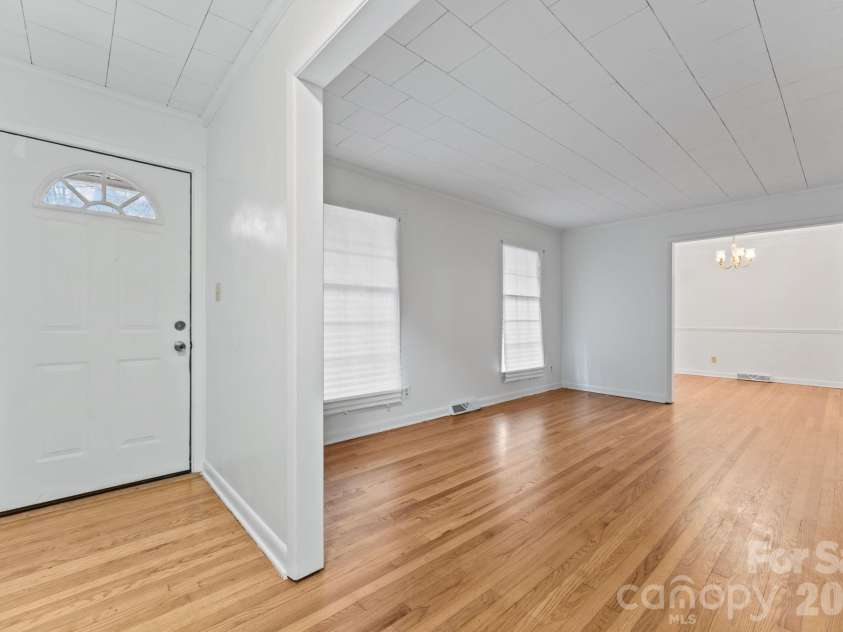 217 Lambert Road, Biscoe, NC 27209.  MLS# CAR4357654, YatesRealty ID 11588. Foyer view from front door into living room and then dining room