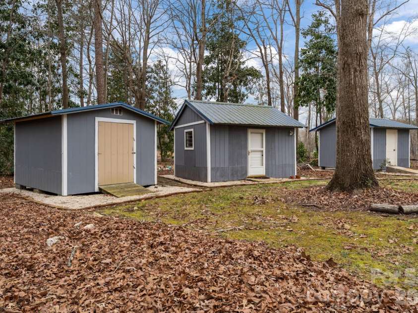 217 Lambert Road, Biscoe, NC 27209.  MLS# CAR4357654, YatesRealty ID 11588. Sheds in the backyard