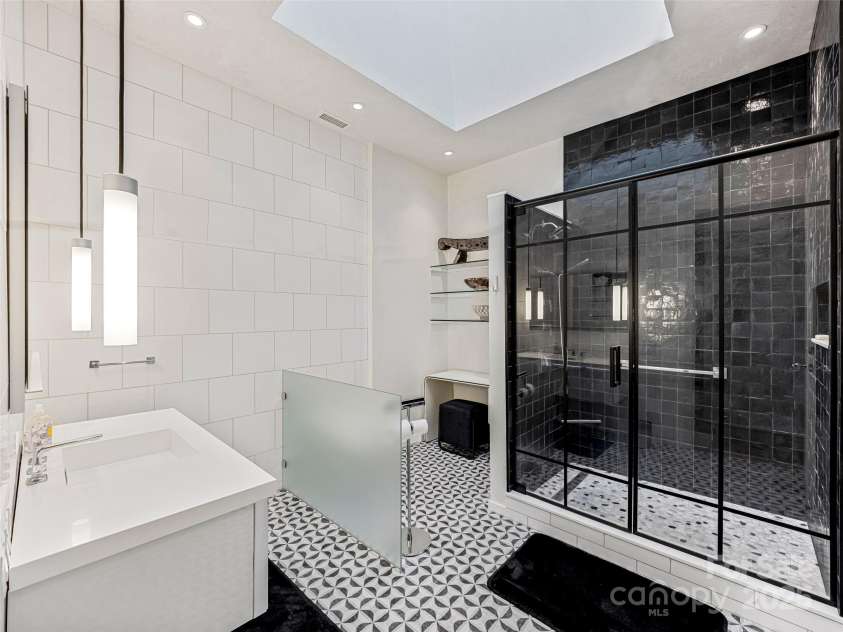 75 Broadway Street, Asheville, NC 28801.  MLS# CAR4219180, YatesRealty ID 11589. Outstanding updated primary bath with two story skylight