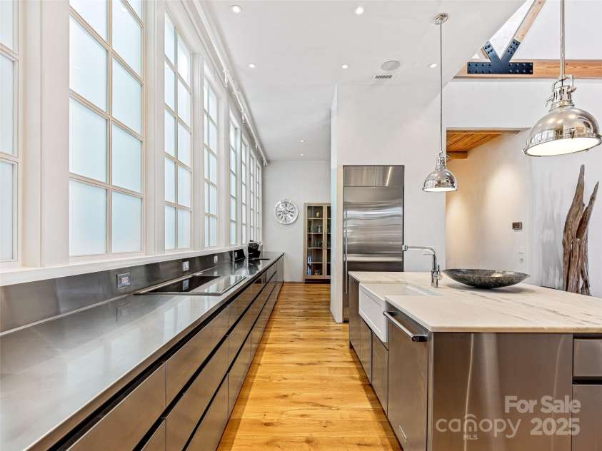 75 Broadway Street, Asheville, NC 28801.  MLS# CAR4219180, YatesRealty ID 11589. Stainless steel wrapped wooden cabinets