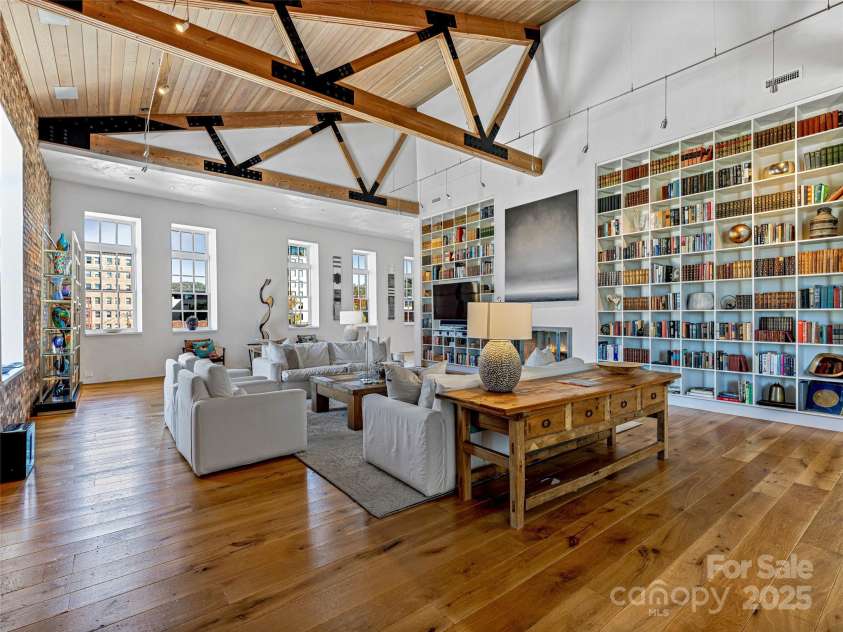 75 Broadway Street, Asheville, NC 28801.  MLS# CAR4219180, YatesRealty ID 11589. Two-story library wall with integrated entertainment center