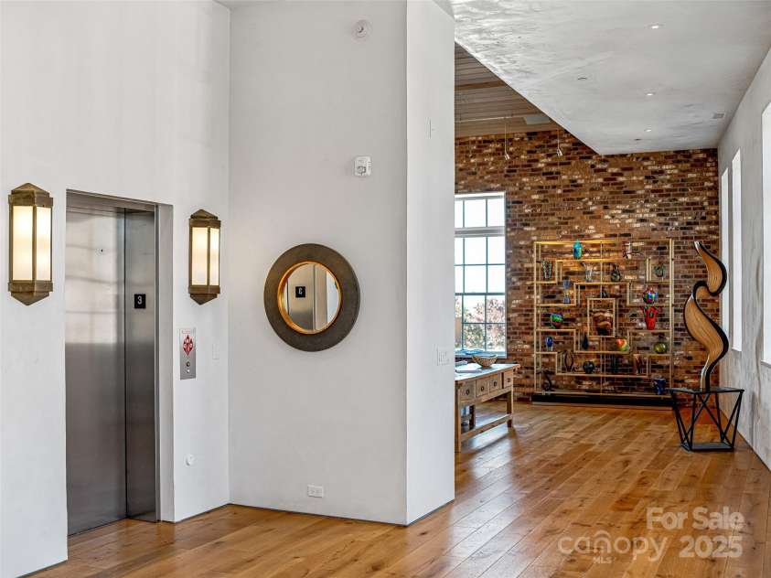 75 Broadway Street, Asheville, NC 28801.  MLS# CAR4219180, YatesRealty ID 11589. Welcoming foyer from this private elevator access.