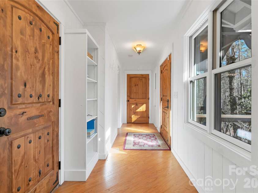 231 Cedar Lane, Brevard, NC 28712.  MLS# CAR4358033, YatesRealty ID 11596. Hallway to 2010 addition