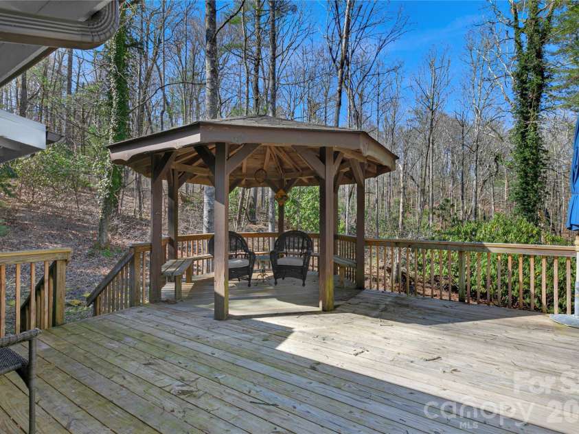 231 Cedar Lane, Brevard, NC 28712.  MLS# CAR4358033, YatesRealty ID 11596. Private back porch