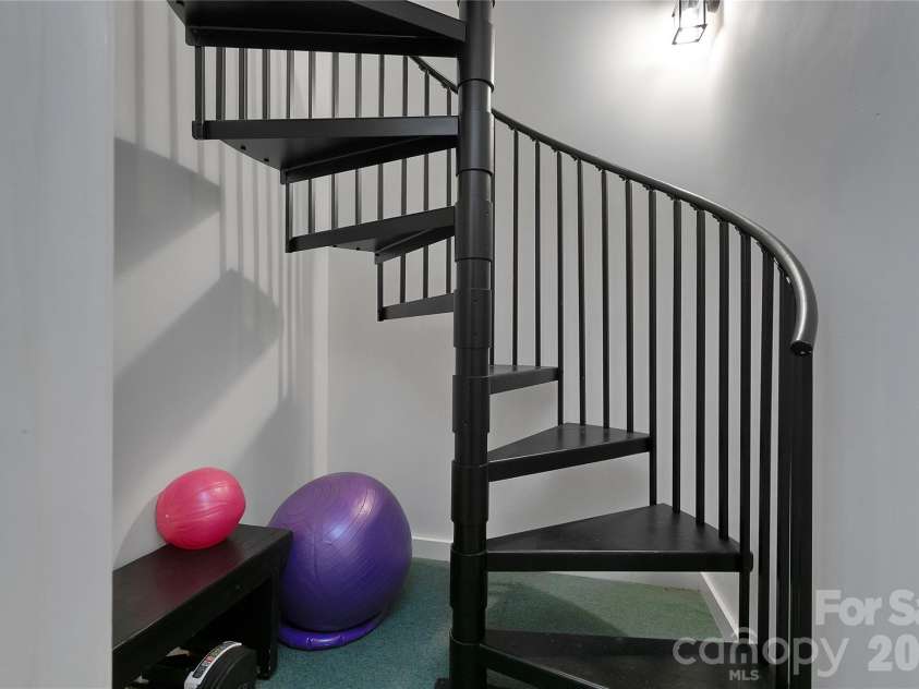 231 Cedar Lane, Brevard, NC 28712.  MLS# CAR4358033, YatesRealty ID 11596. Staircase to basement