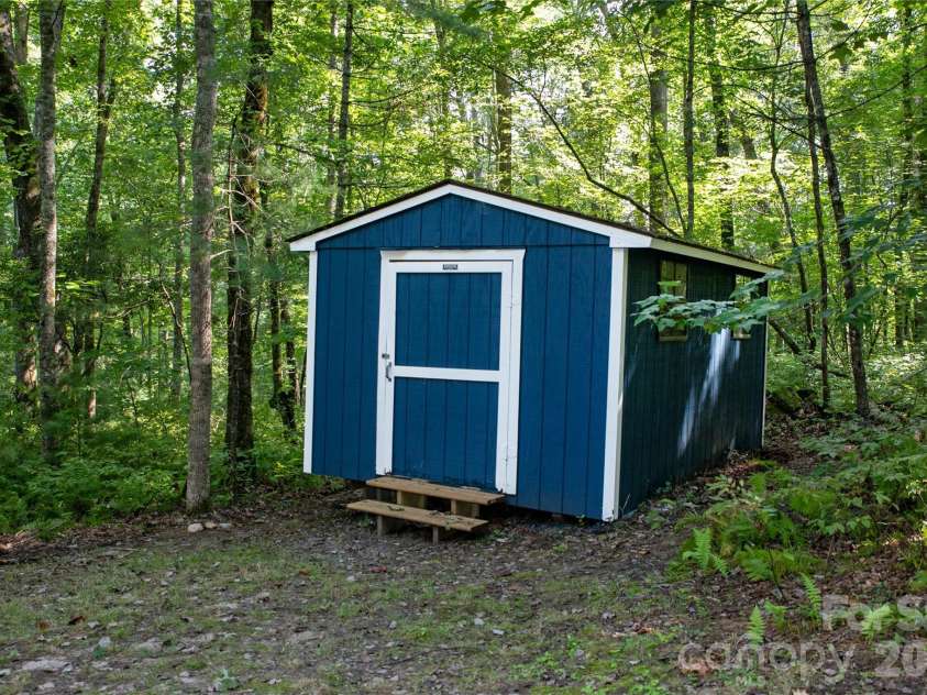 231 Cedar Lane, Brevard, NC 28712.  MLS# CAR4358033, YatesRealty ID 11596. Storage shed