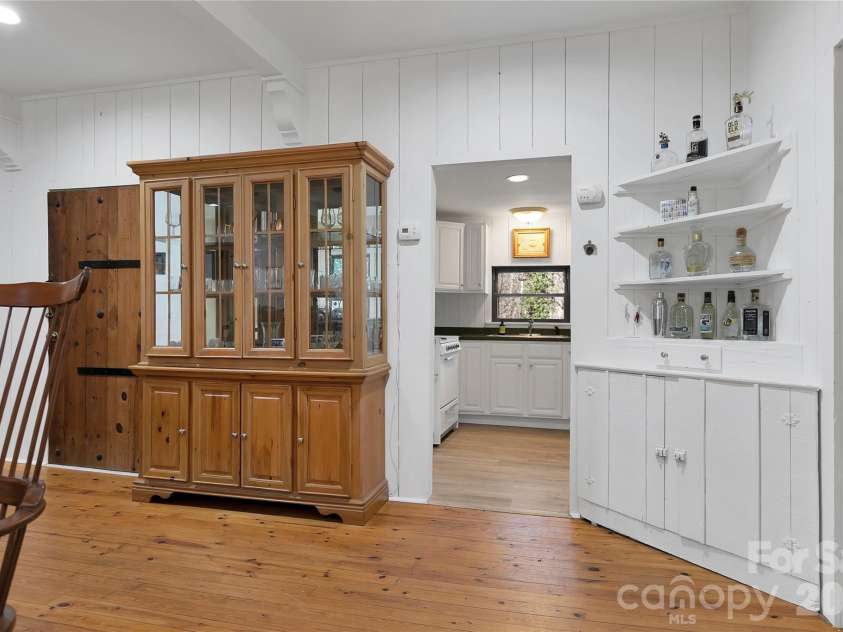 231 Cedar Lane, Brevard, NC 28712.  MLS# CAR4358033, YatesRealty ID 11596. View to the kitchen
