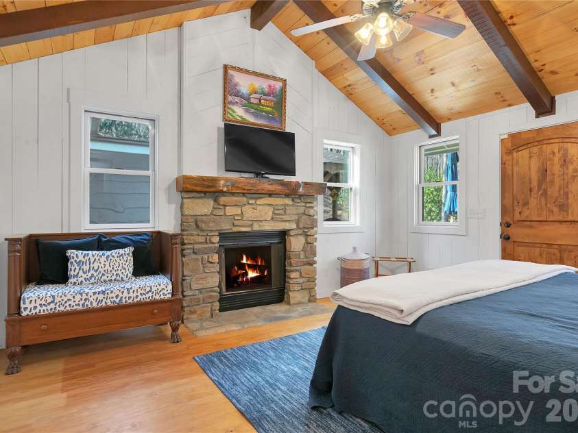 231 Cedar Lane, Brevard, NC 28712.  MLS# CAR4358033, YatesRealty ID 11596. Wood fireplace with gas starter
