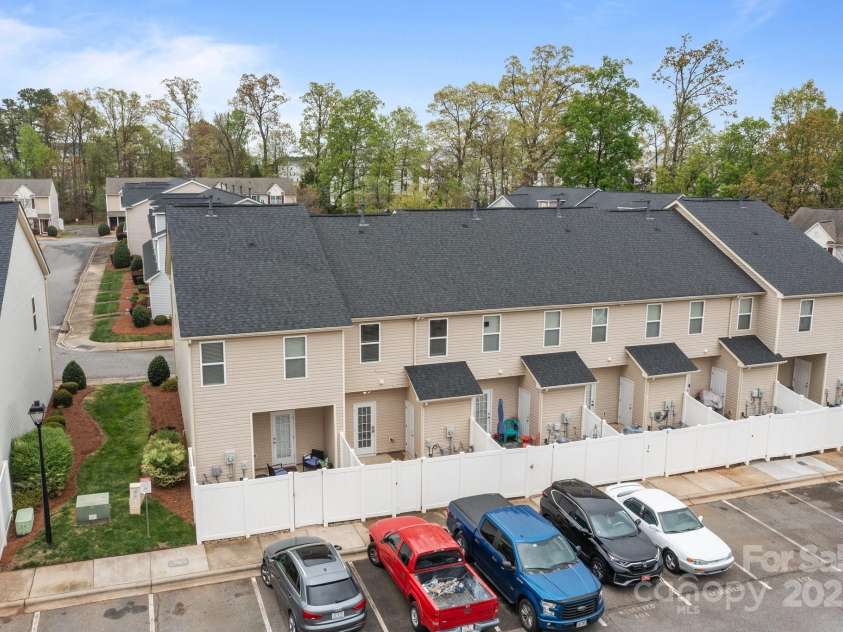 12550 McGrath Drive, Charlotte, NC 28269.  MLS# CAR4242569, YatesRealty ID 11597. Parking is a breeze at Prosperity Place, and conveniently located just off of your fenced in patio.