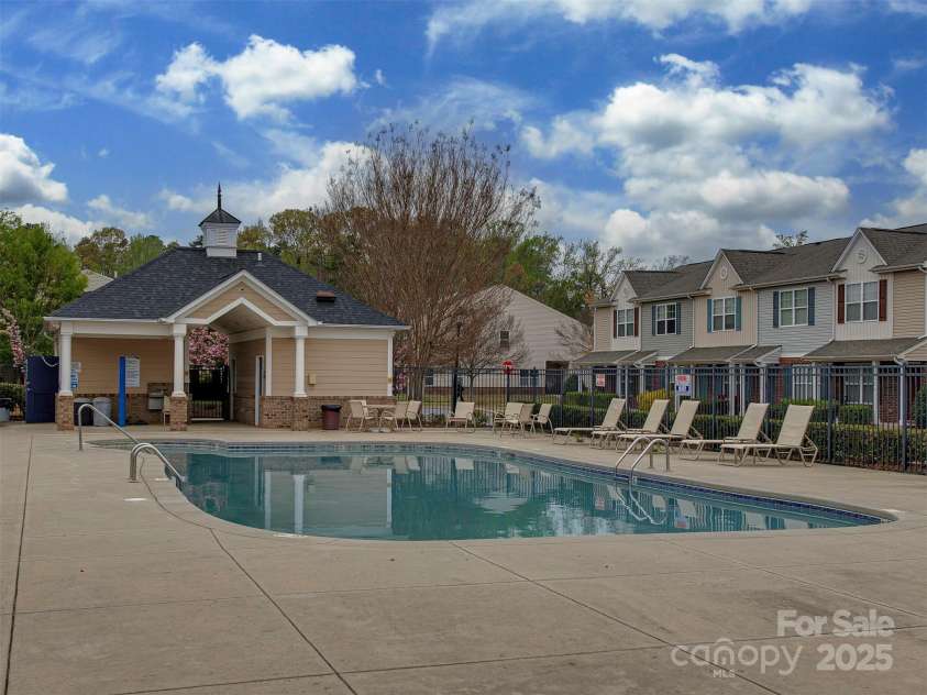 12550 McGrath Drive, Charlotte, NC 28269.  MLS# CAR4242569, YatesRealty ID 11597. Suit up, grab a towel, and make your way over to the community pool—just a stone’s throw from home—for some sun-soaked fun and a refreshing dip!