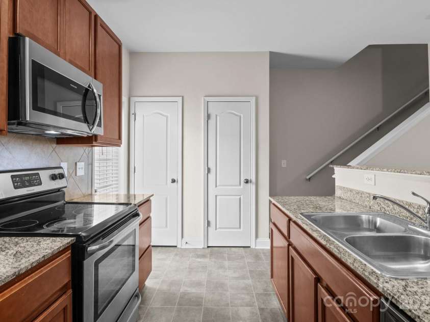 12550 McGrath Drive, Charlotte, NC 28269.  MLS# CAR4242569, YatesRealty ID 11597. With a pantry and bonus storage just steps from the kitchen, who says you can't have it all!