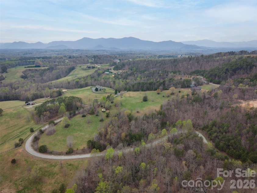 345 Preservation Trail, Columbus, NC 28722.  MLS# CAR4357487, YatesRealty ID 11600. 15.39 ac with mountains in background