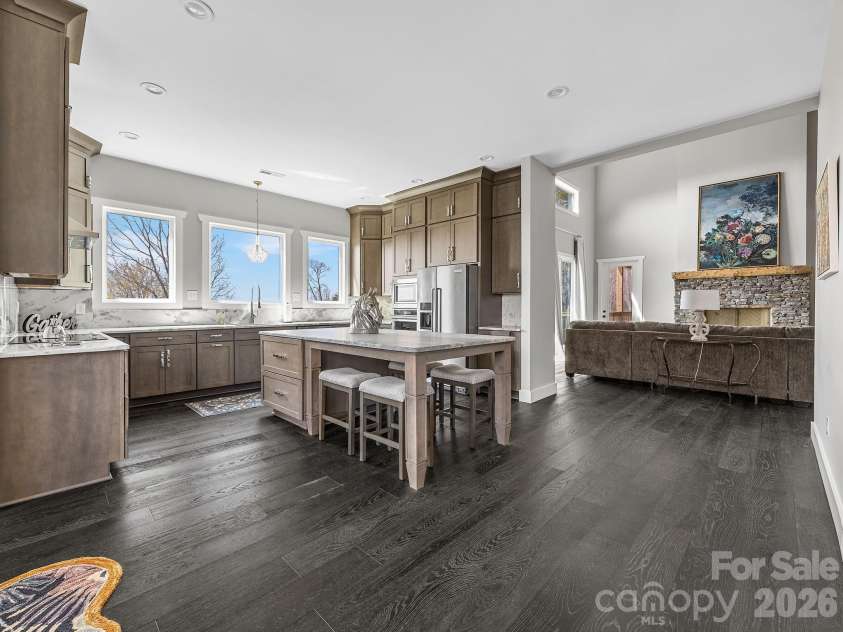 345 Preservation Trail, Columbus, NC 28722.  MLS# CAR4357487, YatesRealty ID 11600. Chef's kitchen looking into living room
