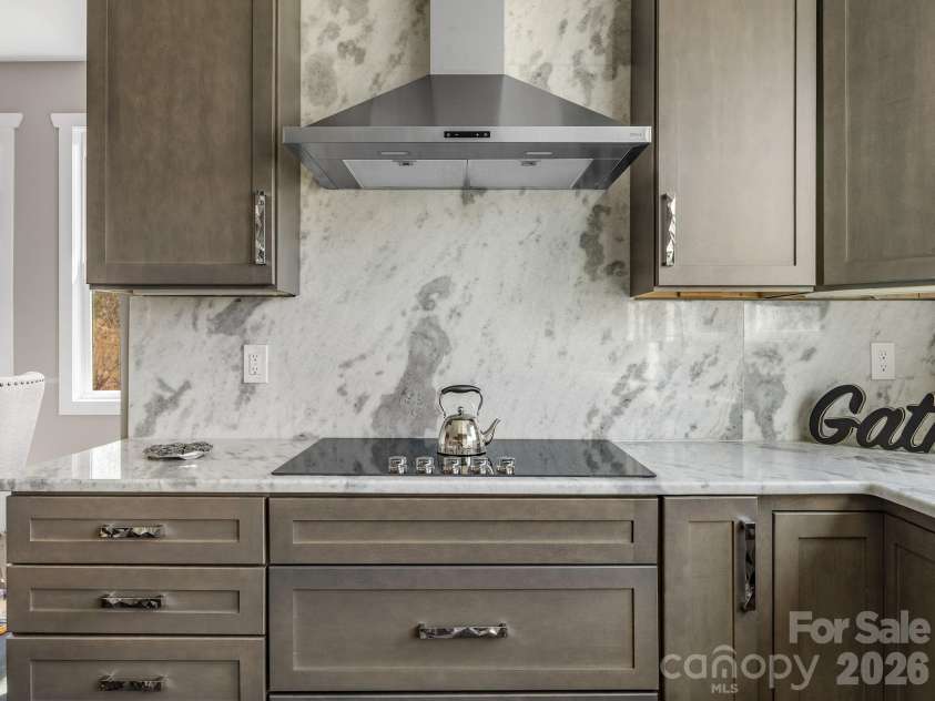 345 Preservation Trail, Columbus, NC 28722.  MLS# CAR4357487, YatesRealty ID 11600. Counter to ceiling marble.