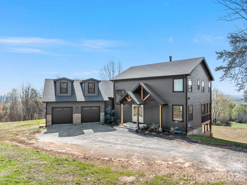 345 Preservation Trail, Columbus, NC 28722.  MLS# CAR4357487, YatesRealty ID 11600. Front view. Double car garage with dormers
