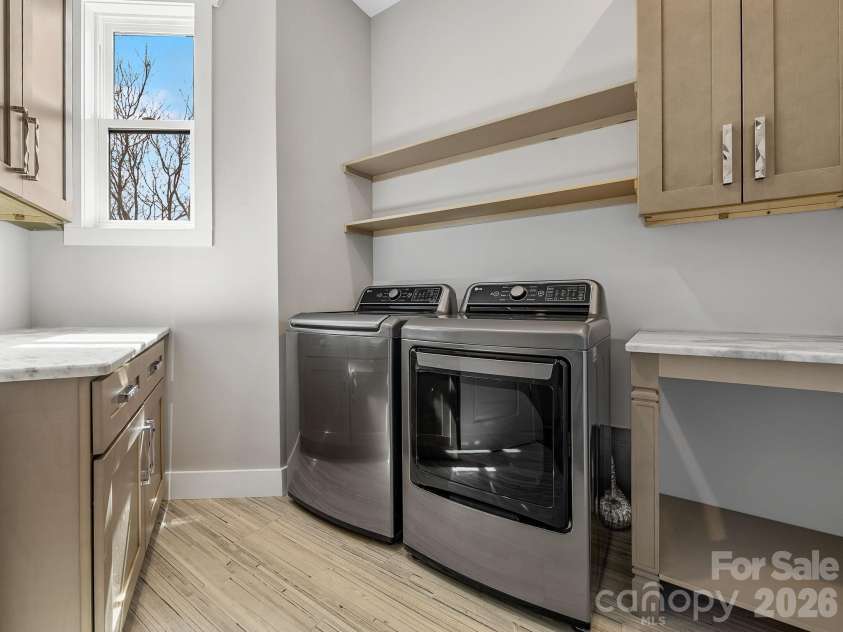345 Preservation Trail, Columbus, NC 28722.  MLS# CAR4357487, YatesRealty ID 11600. Laundry Room with ample workspace, high capacity laundry appliances and generous storage.