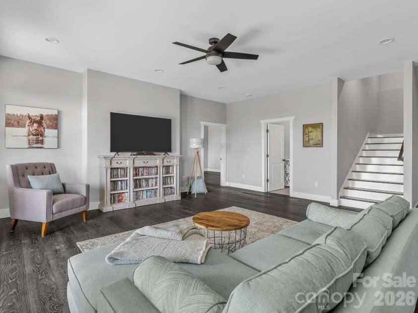 345 Preservation Trail, Columbus, NC 28722.  MLS# CAR4357487, YatesRealty ID 11600. Lower level gathering room between bedroom suites.