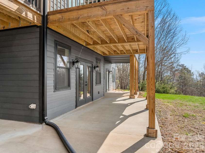 345 Preservation Trail, Columbus, NC 28722.  MLS# CAR4357487, YatesRealty ID 11600. Lower level patio.