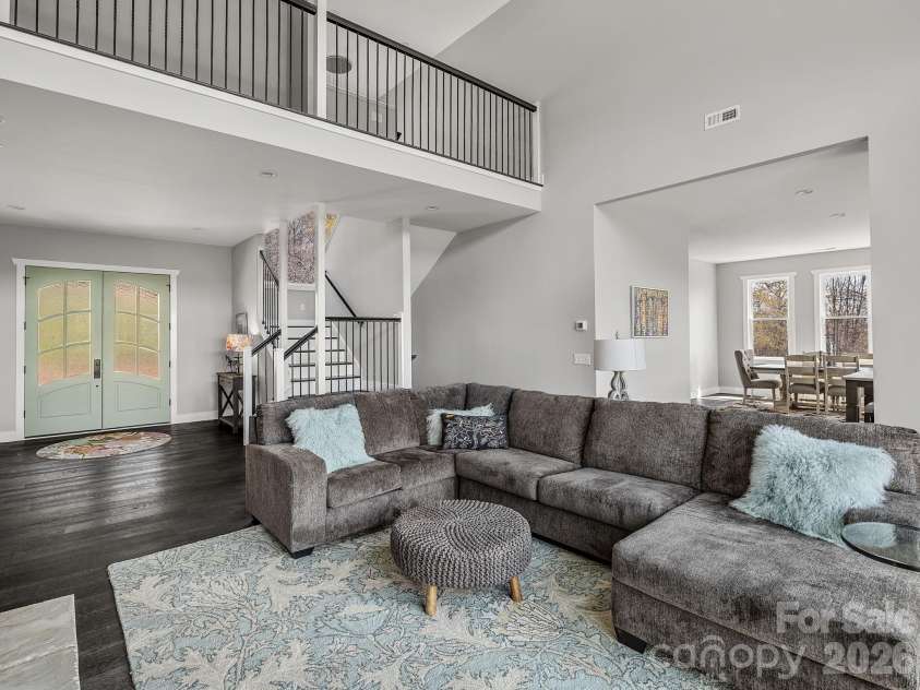 345 Preservation Trail, Columbus, NC 28722.  MLS# CAR4357487, YatesRealty ID 11600. Open plan with stairway to upper floor primary suite.