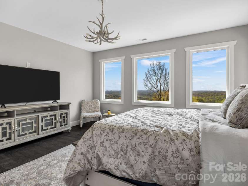 345 Preservation Trail, Columbus, NC 28722.  MLS# CAR4357487, YatesRealty ID 11600. Primary suite, antler chandier.