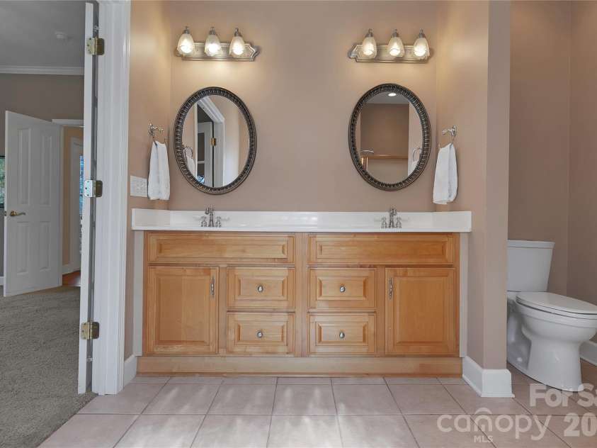 63 Wanei Court, Brevard, NC 28712.  MLS# CAR4359510, YatesRealty ID 11607. Double vanity sinks in the Primary Bath