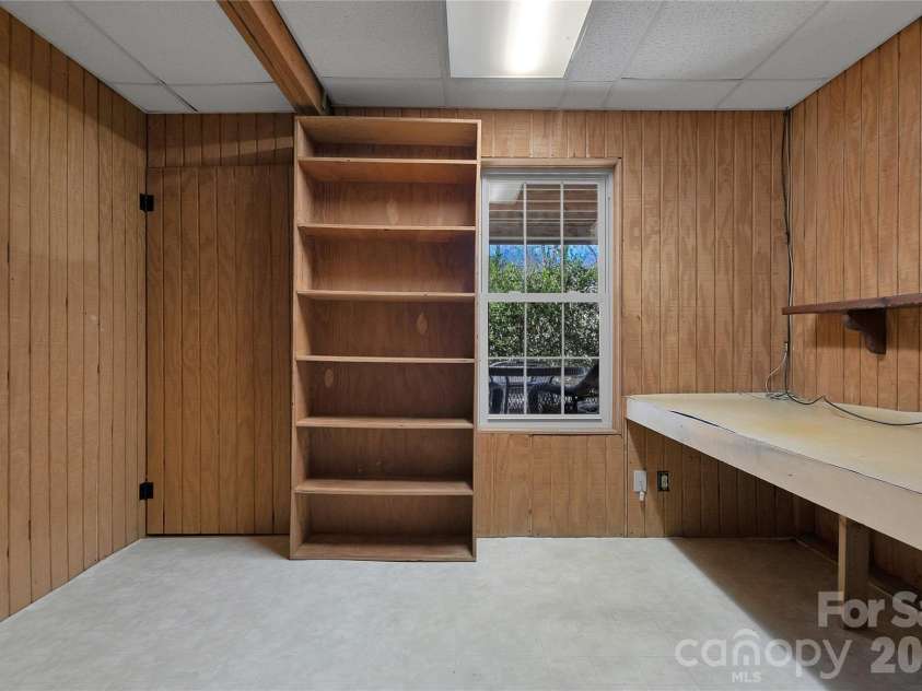 63 Wanei Court, Brevard, NC 28712.  MLS# CAR4359510, YatesRealty ID 11607. Owner used this basement space as an office.