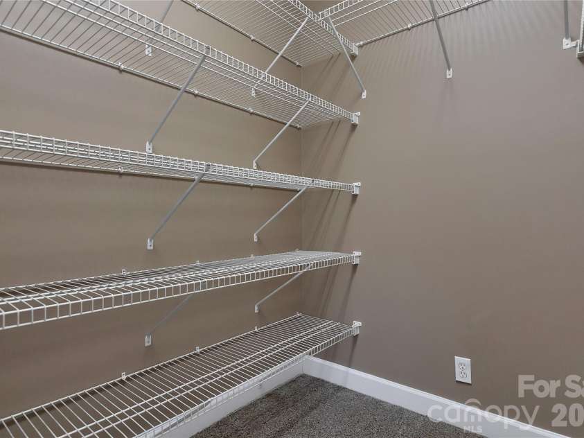 63 Wanei Court, Brevard, NC 28712.  MLS# CAR4359510, YatesRealty ID 11607. Spacious Primary Bedroom walk-in closet