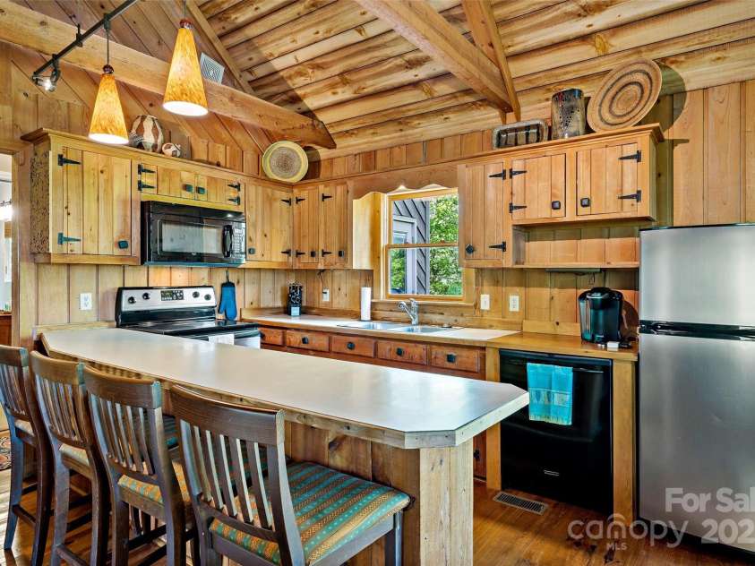 1795 Mckenzie Way, Old Fort, NC 28762.  MLS# CAR4256419, YatesRealty ID 11609. Bar for quick dining to hit the trails again!