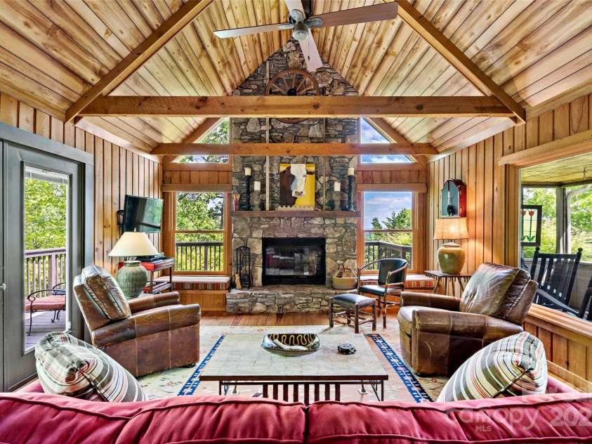 1795 Mckenzie Way, Old Fort, NC 28762.  MLS# CAR4256419, YatesRealty ID 11609. Inviting great room offers panoramic windows and a floor to ceiling fireplace. 