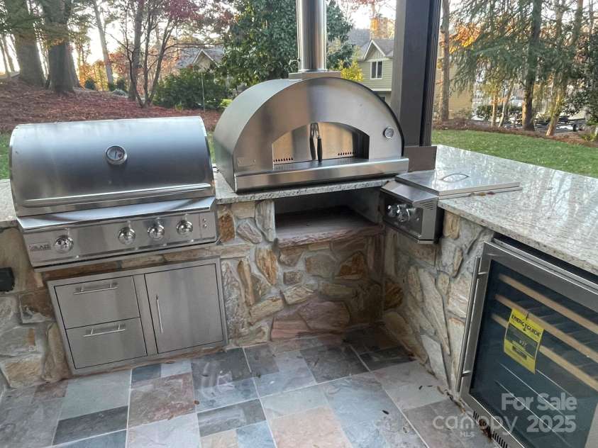 377 Riverwood Road, Mooresville, NC 28117.  MLS# CAR4192992, YatesRealty ID 11616. A chef's dream outdoor kitchen ready for use!