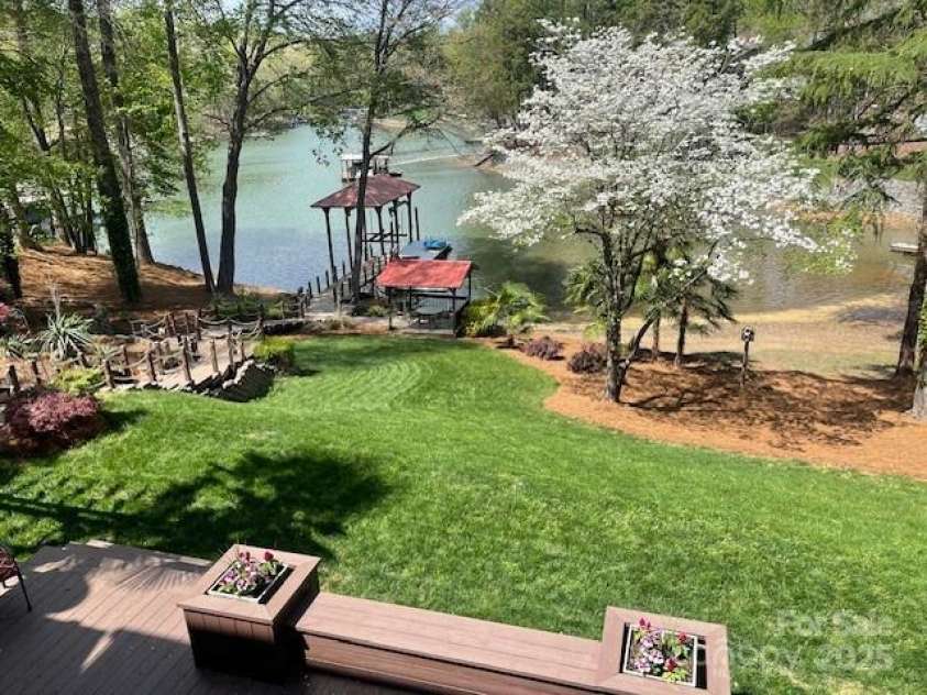 377 Riverwood Road, Mooresville, NC 28117.  MLS# CAR4192992, YatesRealty ID 11616. Beautiful waterviews from all 3 floors of home...fresh pine needles and beautiful Dogwoods in bloom.