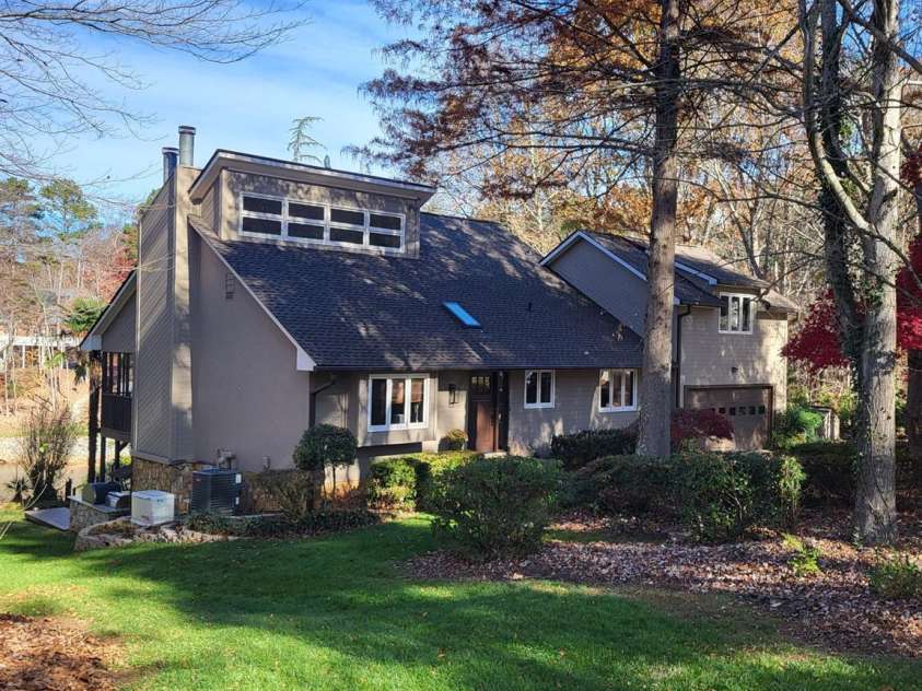 377 Riverwood Road, Mooresville, NC 28117.  MLS# CAR4192992, YatesRealty ID 11616. Custom-built home with mature yard with Japanese maples, huge Magnolia tree, and a greenhouse for the gardening lovers.
