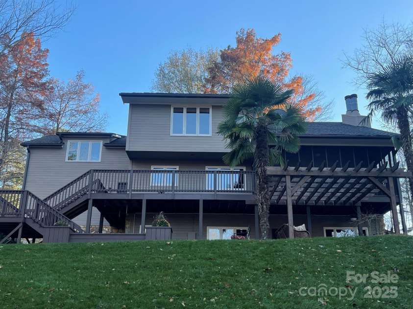 377 Riverwood Road, Mooresville, NC 28117.  MLS# CAR4192992, YatesRealty ID 11616. Custom-built waterfront home with BRAND NEW roof and gutters. Exterior of house and all of decking have also just been painted.