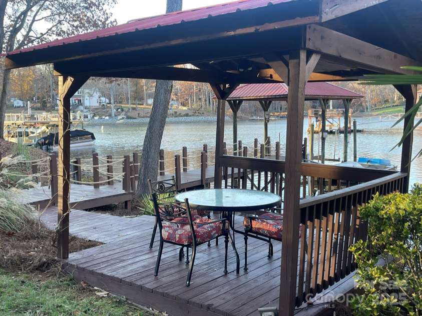 377 Riverwood Road, Mooresville, NC 28117.  MLS# CAR4192992, YatesRealty ID 11616. Enjoy the peacefulness in your gazebo on the water.