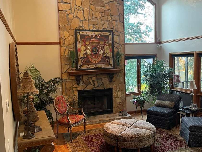 377 Riverwood Road, Mooresville, NC 28117.  MLS# CAR4192992, YatesRealty ID 11616. Enter the home into the bright great room featuring high windows facing front and windows & access to screened-in-porch facing lakeside.