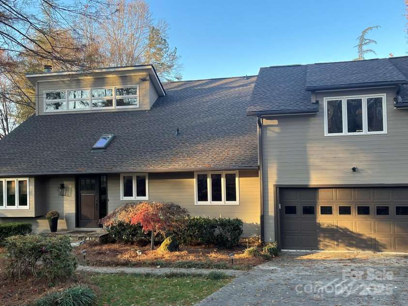 377 Riverwood Road, Mooresville, NC 28117.  MLS# CAR4192992, YatesRealty ID 11616. Front of cedar home all freshly painted with new roof and front door and light fixture.