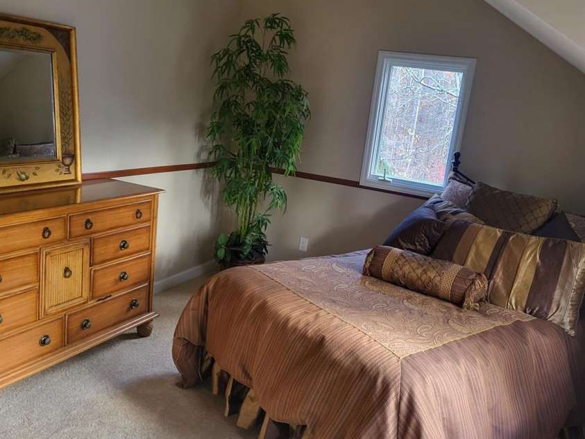 377 Riverwood Road, Mooresville, NC 28117.  MLS# CAR4192992, YatesRealty ID 11616. Front side upstairs bedroom with new ceiling fan and walk-in closet. Brand new carpet!
