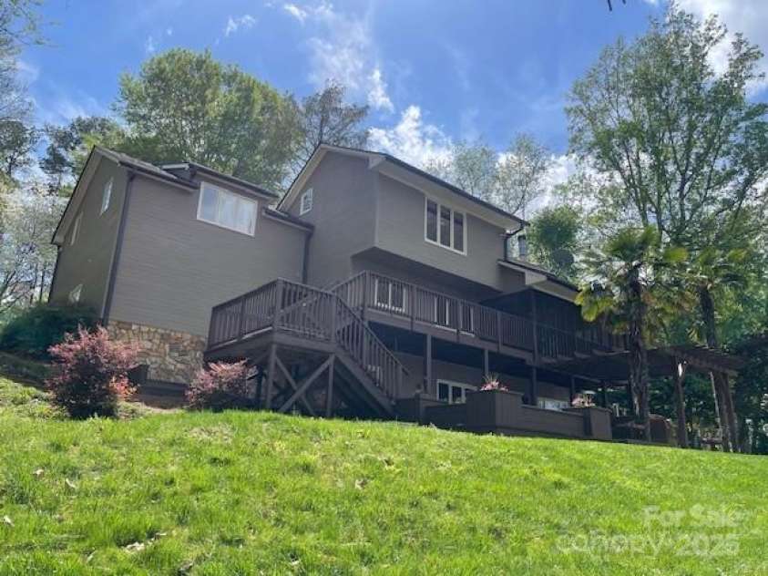 377 Riverwood Road, Mooresville, NC 28117.  MLS# CAR4192992, YatesRealty ID 11616. Home looks grand from the lakeside with the 3 floors.
