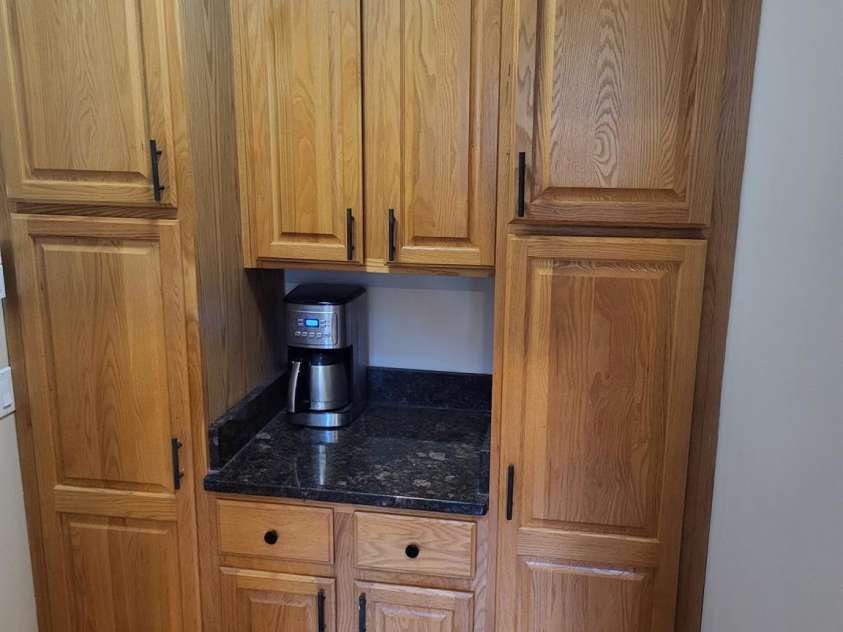 377 Riverwood Road, Mooresville, NC 28117.  MLS# CAR4192992, YatesRealty ID 11616. Panty/coffee bar area.Door to left leads to garage.