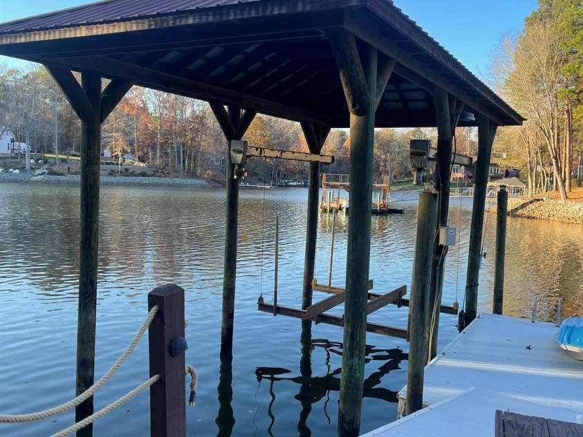 377 Riverwood Road, Mooresville, NC 28117.  MLS# CAR4192992, YatesRealty ID 11616. Pier, floating dock, covered boat lift and jetski ramp!
