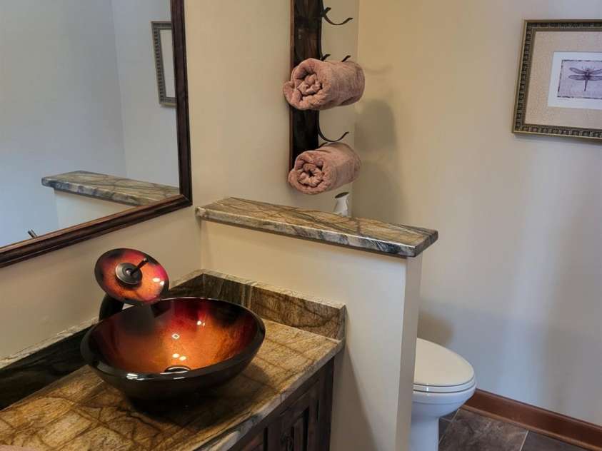 377 Riverwood Road, Mooresville, NC 28117.  MLS# CAR4192992, YatesRealty ID 11616. Primary leathered granite vanity with bowl sink.