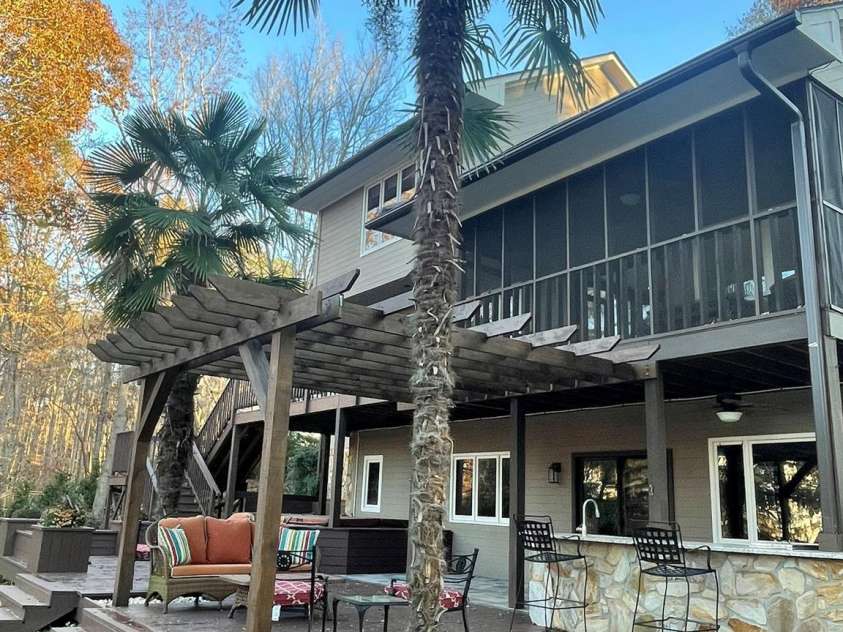 377 Riverwood Road, Mooresville, NC 28117.  MLS# CAR4192992, YatesRealty ID 11616. So many options for outdoor entertaining at this amazing waterfront home! Property also includes a greenhouse, garden shed, and chicken coop w/egg-laying chickens if buyer so desires!!