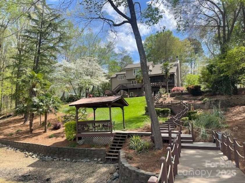 377 Riverwood Road, Mooresville, NC 28117.  MLS# CAR4192992, YatesRealty ID 11616. Stone sea wall in place and pier, walk-ways, and stairs have all new ropes.